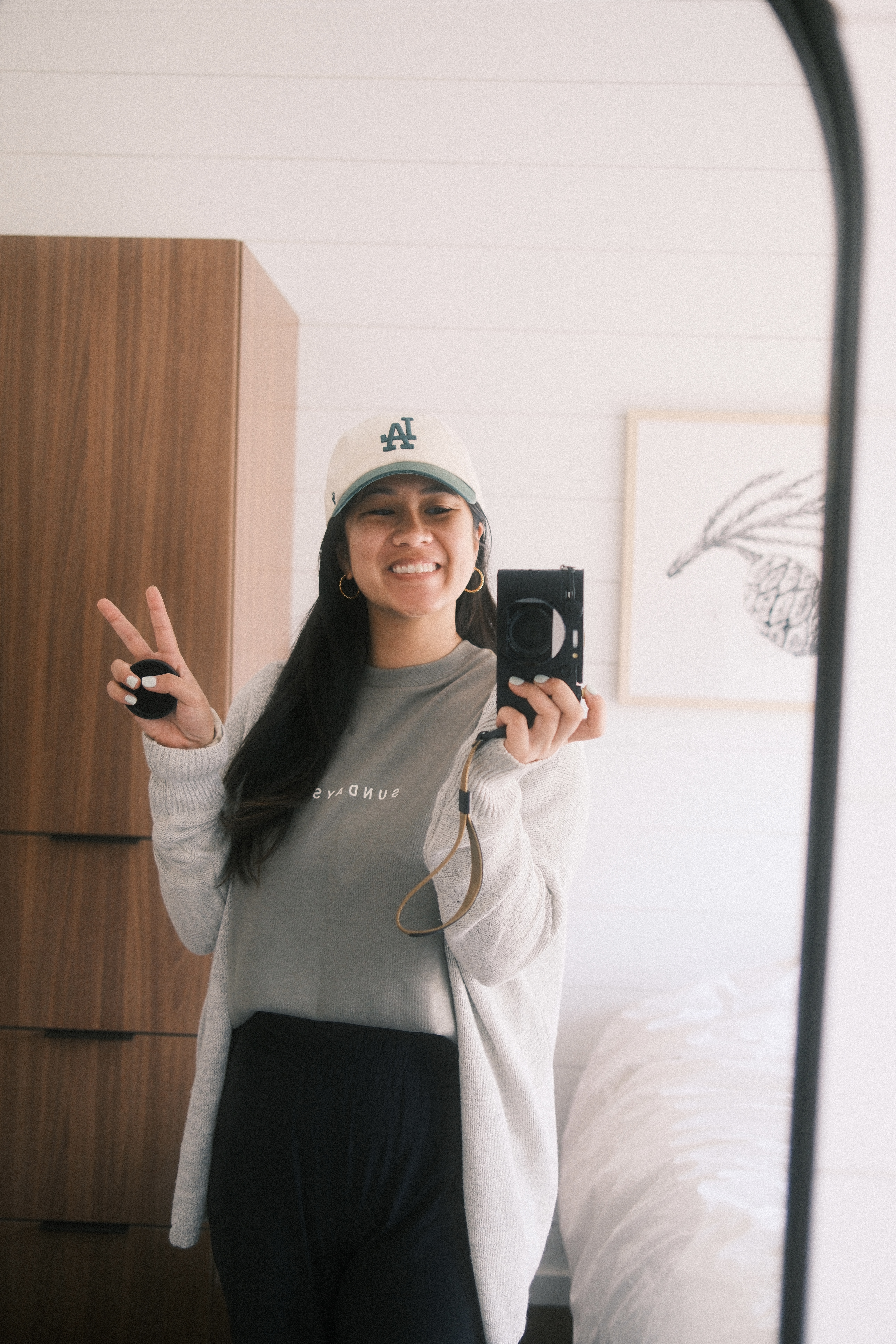 Jane K Lee taking a mirror selfie