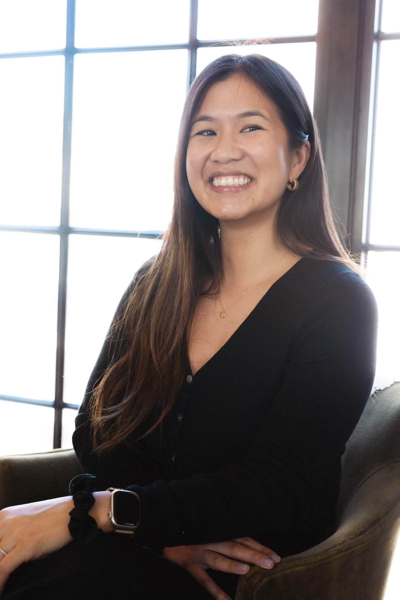 Jane K Lee seated by a window