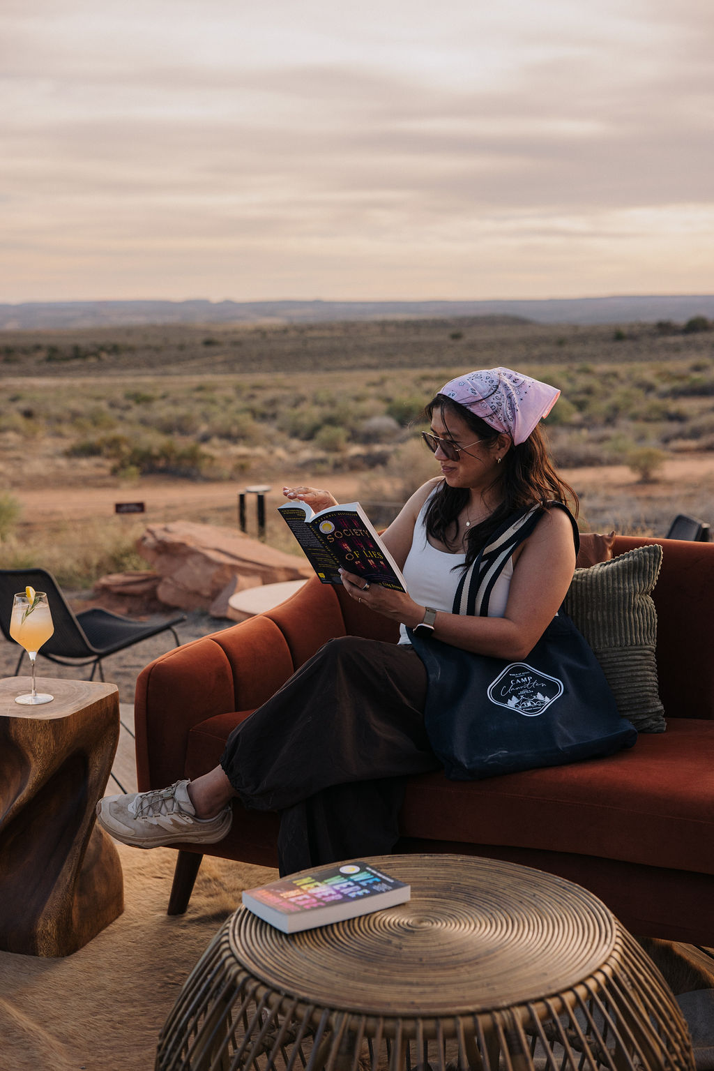 Jane K Lee reading outdoors at Camp Unwritten in Moab